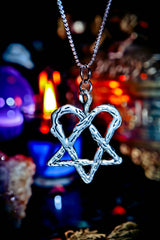 Silver pentagram pendant necklace with a blurred mystical background